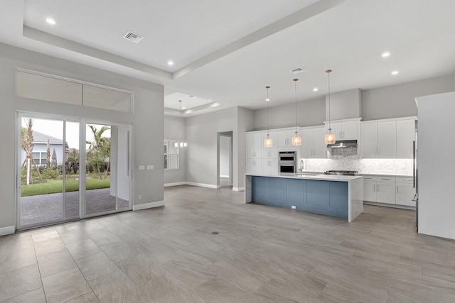 10148 Driftwood Way, Palm Beach Gardens, FL 33412 - kitchen with recessed lighting, light countertops, baseboards, backsplash, and white cabinetry