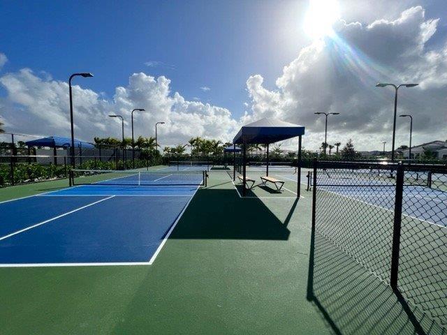 view of tennis court with fence