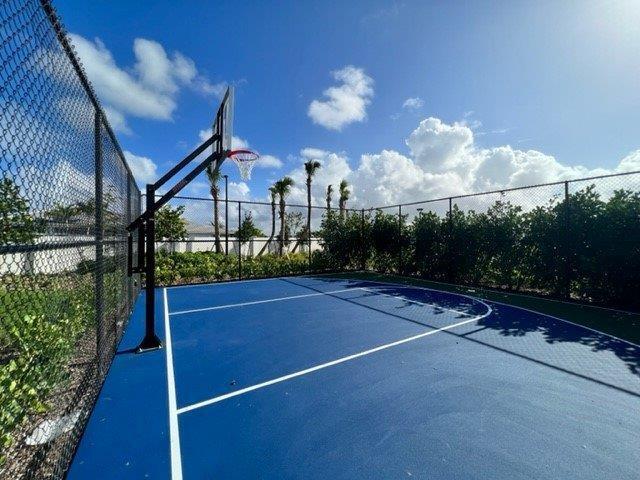 view of basketball court with fence and community basketball court