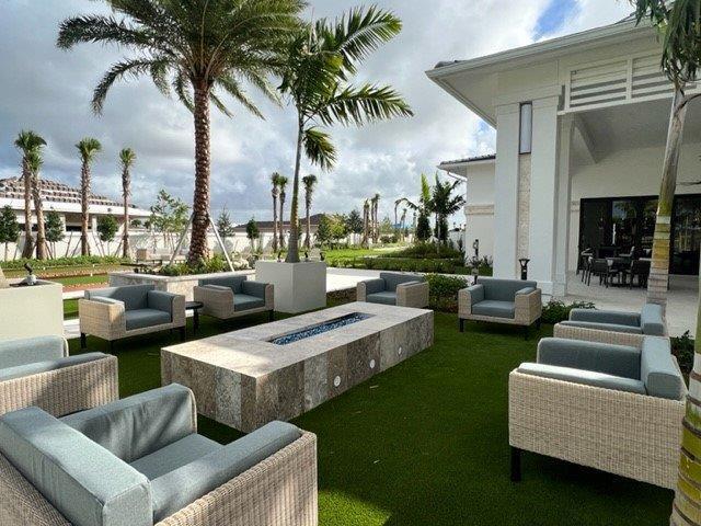 10148 Driftwood Way, Palm Beach Gardens, FL 33412 - view of yard with an outdoor living space with a fire pit and a patio area