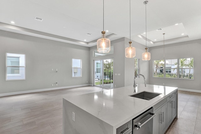 10148 Driftwood Way, Palm Beach Gardens, FL 33412 - kitchen with a sink, a tray ceiling, stainless steel dishwasher, open floor plan, and recessed lighting