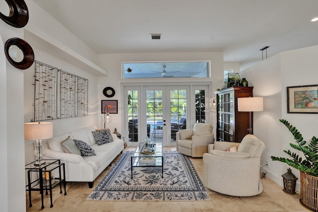 living room featuring french doors, ceiling fan, and tile patterned floors