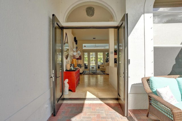 view of exterior entry featuring french doors