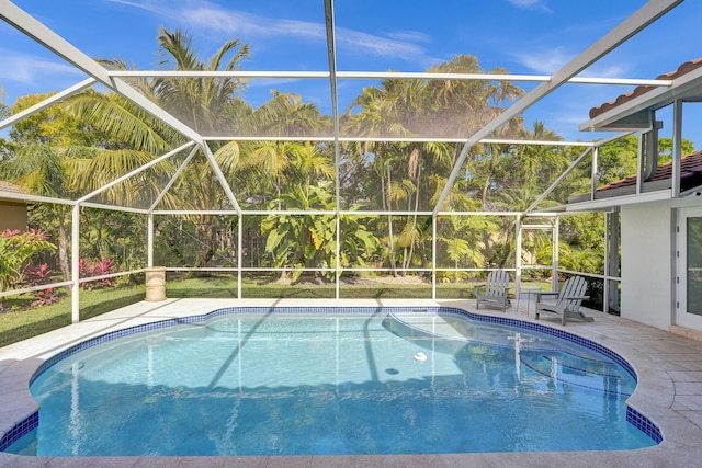outdoor pool featuring a lanai and a patio