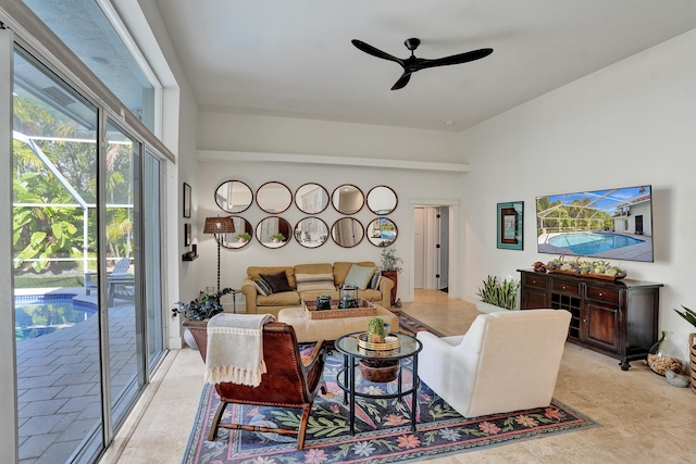 living room with ceiling fan and light tile patterned floors