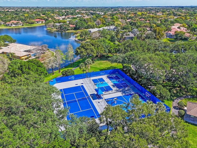 aerial view of a nearby body of water and a tree filled landscape