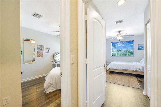 4738 Sundance Way, Davie, FL 33328 - corridor featuring visible vents, baseboards, and wood finished floors