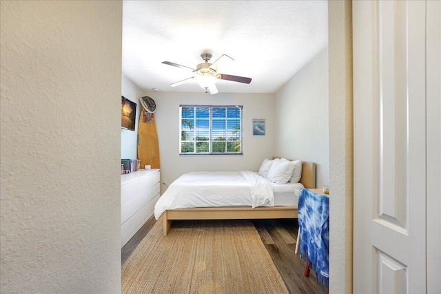 4738 Sundance Way, Davie, FL 33328 - bedroom featuring a textured wall, a ceiling fan, and wood finished floors