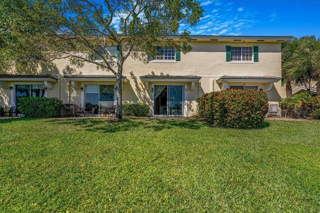 4738 Sundance Way, Davie, FL 33328 - back of house featuring a lawn and stucco siding