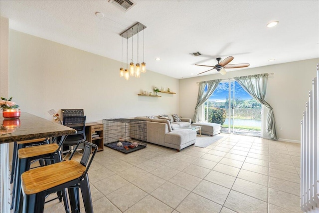4738 Sundance Way, Davie, FL 33328 - living room featuring a water view, a ceiling fan, light tile patterned flooring, and visible vents