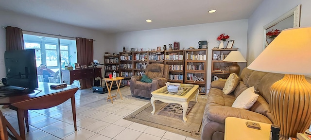 living area with recessed lighting and tile patterned flooring