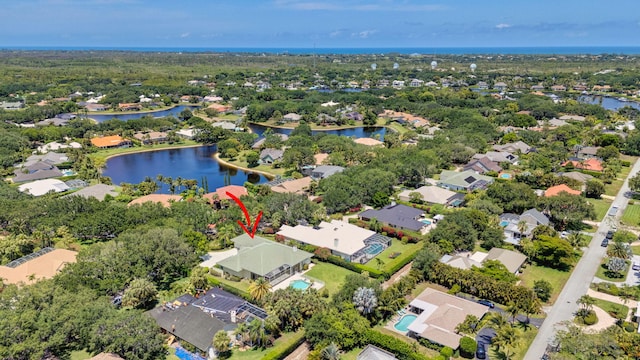 aerial perspective of suburban area with a large body of water