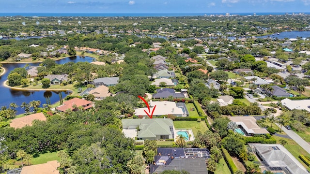 aerial perspective of suburban area featuring a large body of water