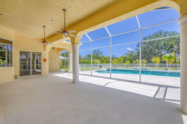 view of pool with a patio area, a ceiling fan, and fence