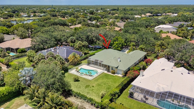 aerial perspective of suburban area featuring a pool area