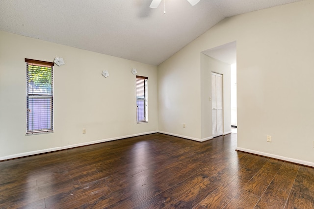 unfurnished room with a ceiling fan, hardwood / wood-style floors, lofted ceiling, and baseboards