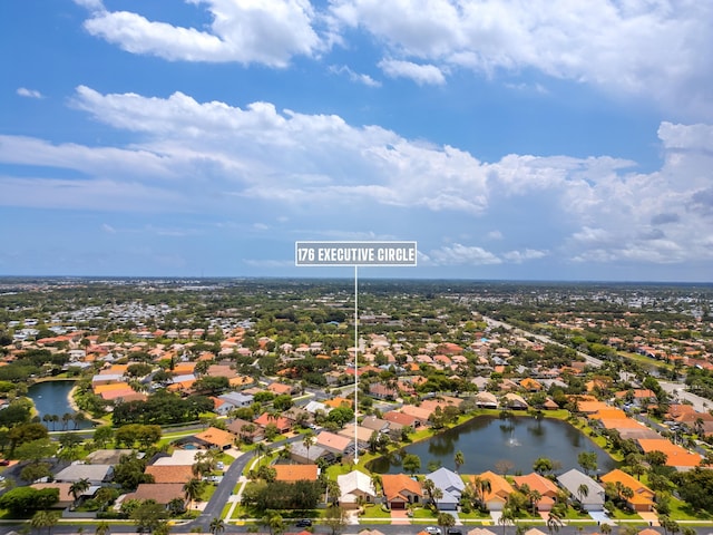 aerial view of residential area featuring a nearby body of water