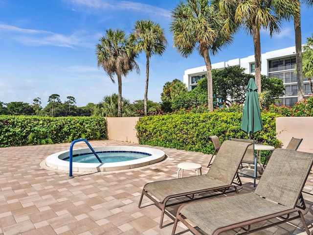 20110 Boca W Dr Unit 232, Boca Raton, FL 33434 - view of swimming pool with a hot tub and a patio