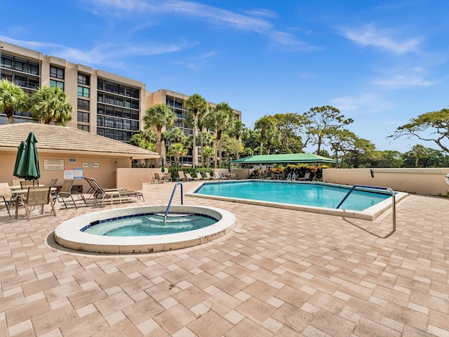 20110 Boca W Dr Unit 232, Boca Raton, FL 33434 - community pool with a patio area and a community hot tub