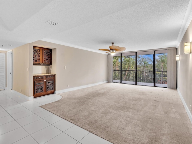 20110 Boca W Dr Unit 232, Boca Raton, FL 33434 - unfurnished living room featuring a textured ceiling, baseboards, and light tile patterned floors