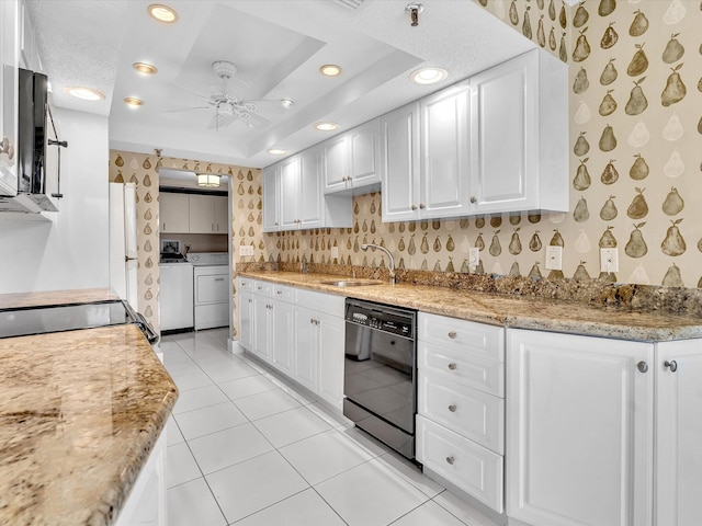 20110 Boca W Dr Unit 232, Boca Raton, FL 33434 - kitchen featuring wallpapered walls, washer and dryer, ceiling fan, a sink, and black appliances