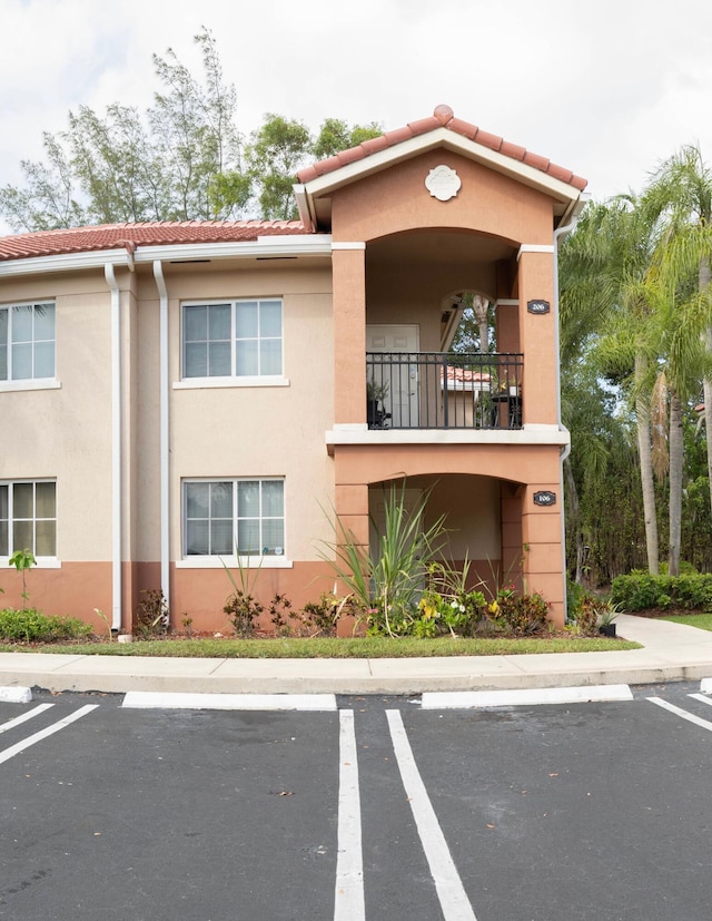 view of property with uncovered parking