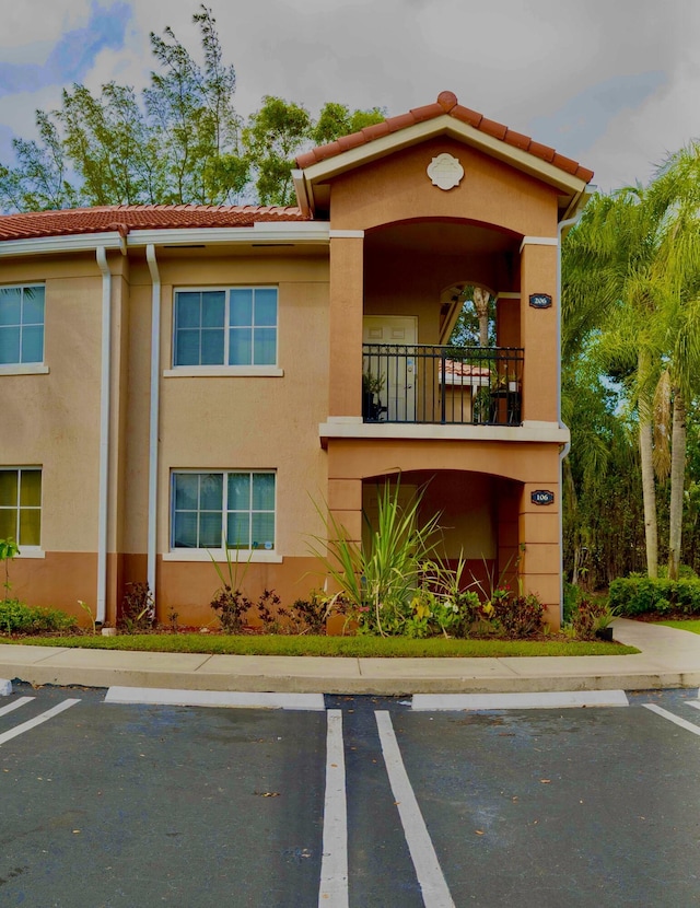 3500 Briar Bay Blvd Unit 106, West Palm Beach, FL 33411 - view of property with uncovered parking