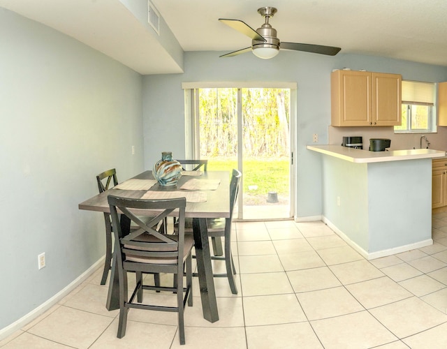 3500 Briar Bay Blvd Unit 106, West Palm Beach, FL 33411 - dining space featuring a ceiling fan, light tile patterned floors, and baseboards