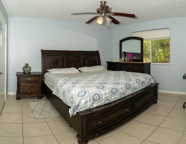 3500 Briar Bay Blvd Unit 106, West Palm Beach, FL 33411 - bedroom with light tile patterned flooring, baseboards, and ceiling fan