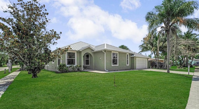 1501 Lee Ct, Lake Worth, FL 33461 - ranch-style house with a garage, concrete driveway, stucco siding, a front yard, and a metal roof