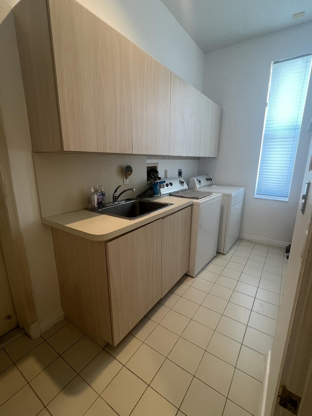 1501 Lee Ct, Lake Worth, FL 33461 - laundry area with cabinet space, washing machine and dryer, and light tile patterned floors