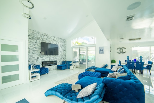 4941 SW 150th Ter, Miramar, FL 33027 - living area with a glass covered fireplace, high vaulted ceiling, and tile patterned flooring