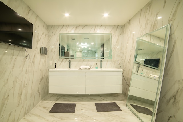 4941 SW 150th Ter, Miramar, FL 33027 - bathroom featuring double vanity, a marble finish shower, and marble finish floors