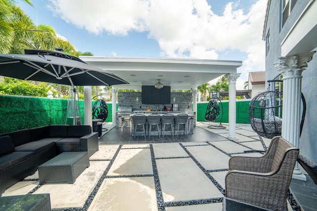 4941 SW 150th Ter, Miramar, FL 33027 - view of patio / terrace with exterior bar, an outdoor hangout area, and a fenced backyard