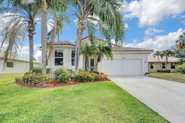 mediterranean / spanish-style home featuring stucco siding, an attached garage, a tiled roof, and driveway