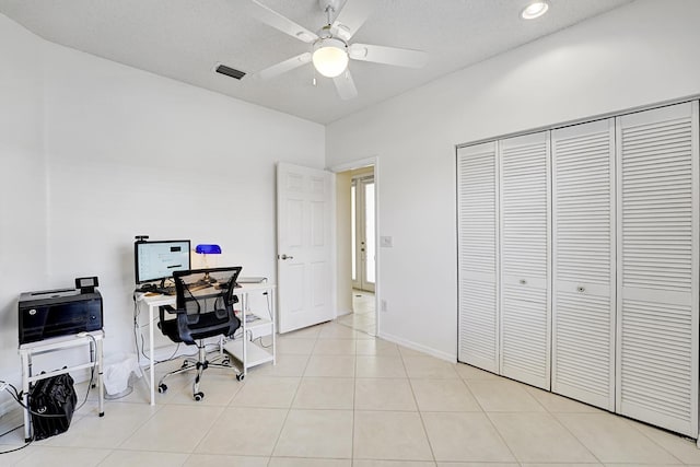 office space featuring light tile patterned flooring, visible vents, recessed lighting, ceiling fan, and baseboards