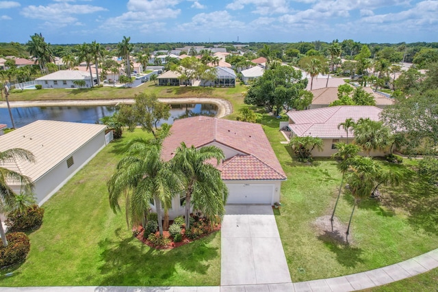 bird's eye view featuring a water view and a residential view