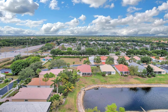 bird's eye view featuring a water view and a residential view