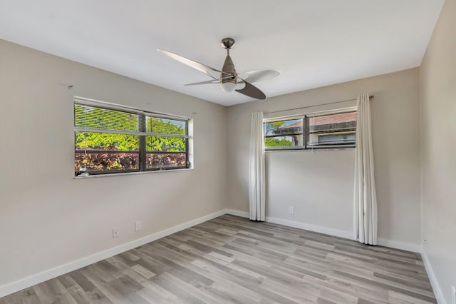 4875 Hawkwood Rd Unit B, Boynton Beach, FL 33436 - unfurnished room with ceiling fan, baseboards, and light wood-style floors