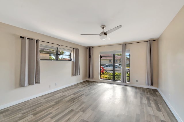 4875 Hawkwood Rd Unit B, Boynton Beach, FL 33436 - spare room featuring ceiling fan, baseboards, and wood finished floors
