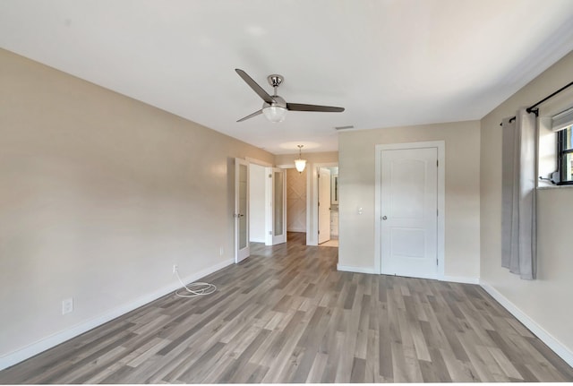 4875 Hawkwood Rd Unit B, Boynton Beach, FL 33436 - unfurnished room featuring light wood-style floors, baseboards, and ceiling fan