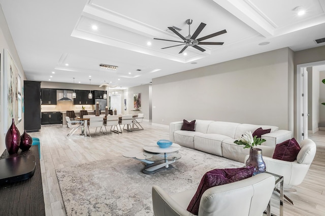 living area with light wood finished floors, baseboards, a ceiling fan, and recessed lighting