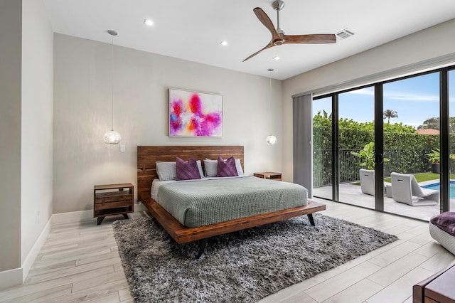 bedroom with light wood finished floors, multiple windows, visible vents, and access to exterior