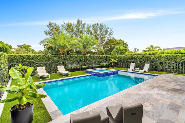 view of swimming pool featuring a pool with connected hot tub, fence private yard, and a patio