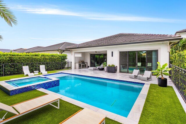 view of swimming pool with a ceiling fan, a pool with connected hot tub, a patio area, grilling area, and area for grilling