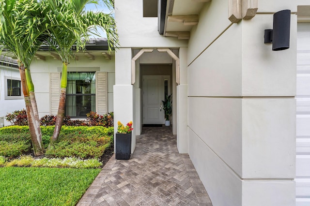 doorway to property with stucco siding