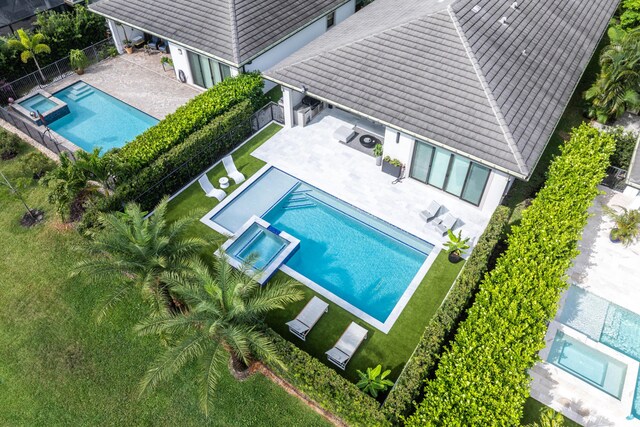 view of subject property with a pool area