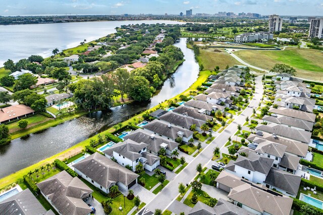 view of urban area featuring a nearby body of water and nearby suburban area