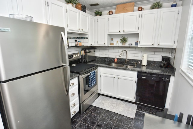 kitchen featuring a sink, open shelves, decorative backsplash, stainless steel appliances, and white cabinets
