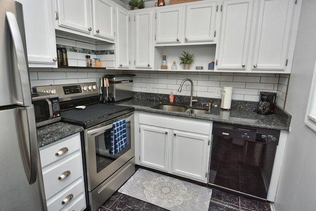 kitchen with stainless steel appliances, open shelves, dark stone countertops, and a sink